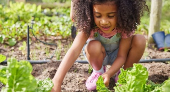 young student on a school field trip in a garden